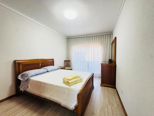 Ένα ή περισσότερα κρεβάτια σε δωμάτιο στο Atlentic Horizon Apartment