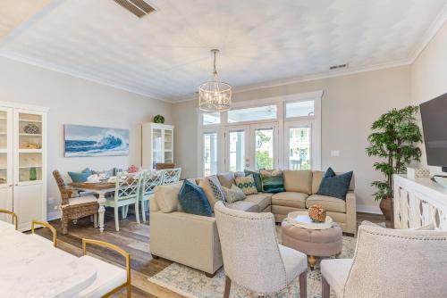 a living room with a couch and a table at 517 The Southend Pier House in Virginia Beach