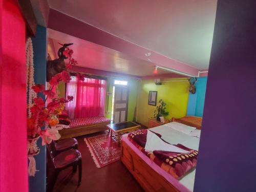 Ένα ή περισσότερα κρεβάτια σε δωμάτιο στο Le Pine Homestay