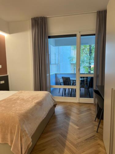 En eller flere senge i et værelse på Mako Suites - Centro e Stazione