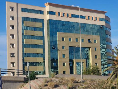 a tall building with a lot of windows at Résidence Tunis Carthage in Ariana