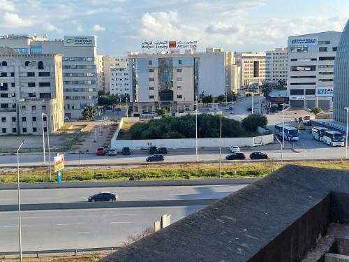 a view of a city with a highway and buildings at Résidence Tunis Carthage in Ariana