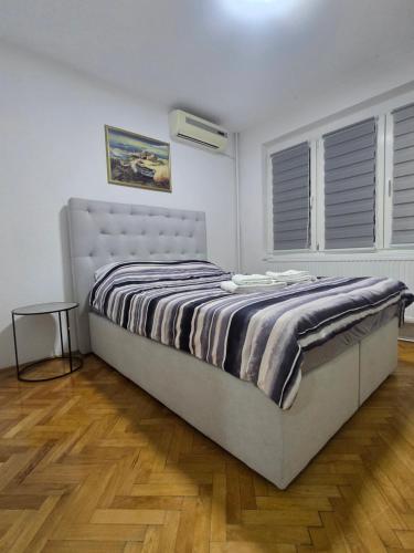 Ένα ή περισσότερα κρεβάτια σε δωμάτιο στο M CityLux Doboj