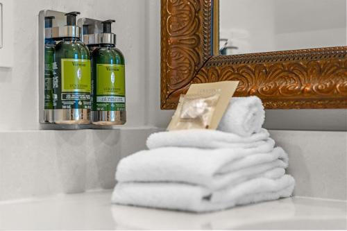 a pile of towels sitting on a counter in a bathroom at Bellasera Resort in Naples