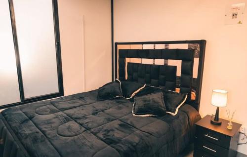 a bedroom with a large bed with pillows on it at Glamping La Maestranza con desayuno incluido in Villamaría