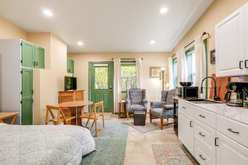 a bedroom with a bed and a kitchen with a table at Less Than half Mi to OSU Studio in Corvallis Near Parks in Corvallis