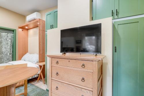 a bedroom with a dresser with a flat screen tv on it at Less Than half Mi to OSU Studio in Corvallis Near Parks in Corvallis
