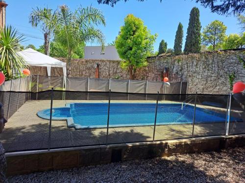 a swimming pool with a fence around it at Quinta El Zorzal in La Unión