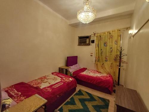 Postel nebo postele na pokoji v ubytování Aswania Gesthouse