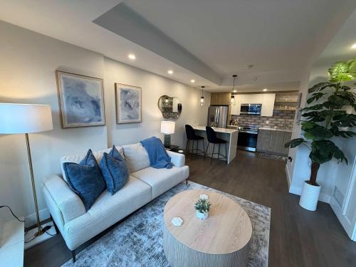 a living room with a couch and a table at Bright 1 BR with waterview and 6 appliances in Halifax