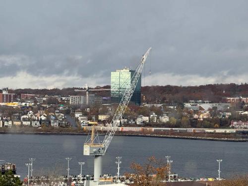 a large crane sitting on top of a body of water at Bright 1 BR with waterview and 6 appliances in Halifax