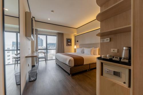 Giường trong phòng chung tại Hotel Límade