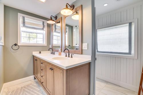 a bathroom with a sink and a mirror at Scenic Waterfront Home with Dock on Lake Winola! in Factoryville