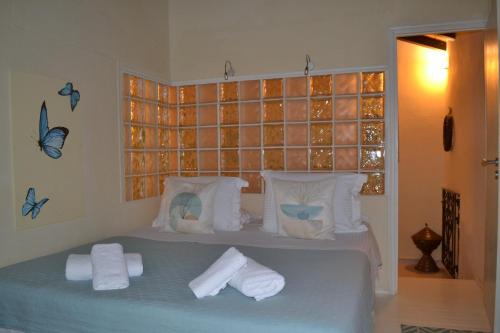 Postel nebo postele na pokoji v ubytování Villa Erifili