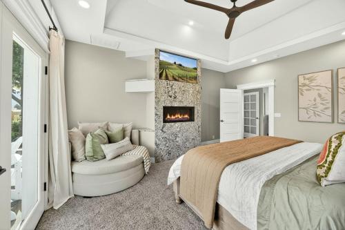 a bedroom with a bed and a fireplace at Meadowsweet Farm- Sleeps 18, Outdoor Kitchen in Talent