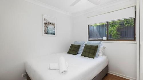 Postel nebo postele na pokoji v ubytování Il Faro, An Italian Inspired Villa in Port Stephens