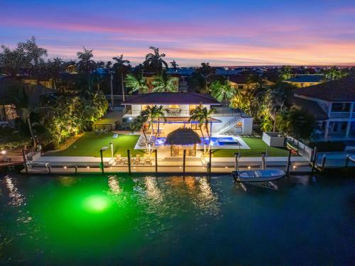 an aerial view of a house on the water at night at Deep Blue Waterfront Gem Pool Kayaks Dock in Key Colony Beach