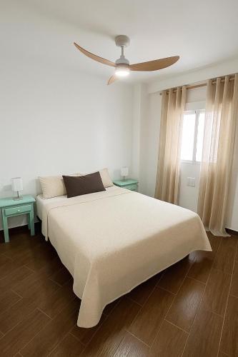 Ένα ή περισσότερα κρεβάτια σε δωμάτιο στο Terraza del Mar Torrevieja