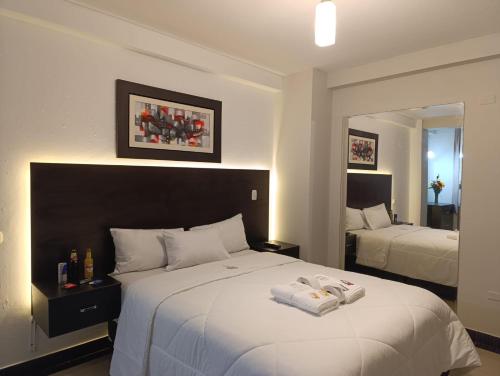 Ένα ή περισσότερα κρεβάτια σε δωμάτιο στο Arabian Hotel