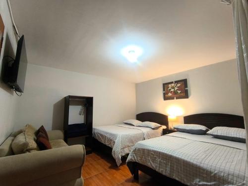 Postel nebo postele na pokoji v ubytování Hotel la encantada