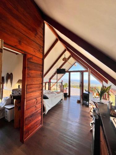 a bedroom with a bed in a room with a view at Terevaka Lodge Rapa Nui in Hanga Roa