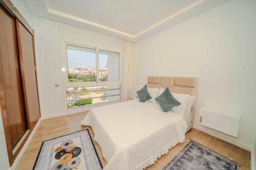 Ένα ή περισσότερα κρεβάτια σε δωμάτιο στο Rabat Apartment