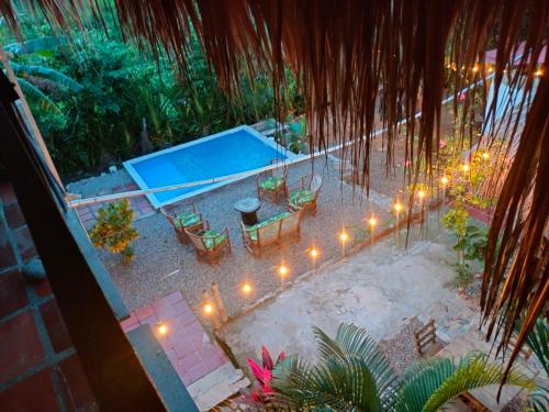 an overhead view of a patio with a pool and lights at Casa sol palomino in Palomino
