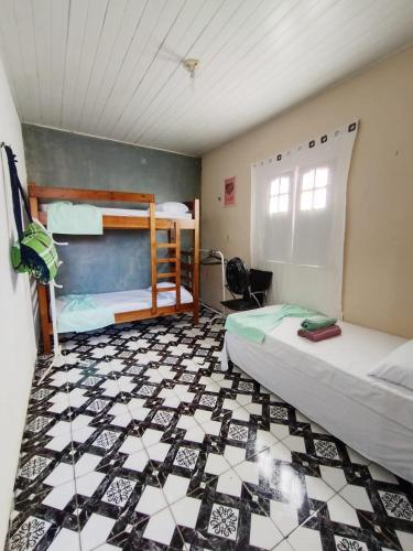 En eller flere senge i et værelse på Kit Net moderna para COP 30