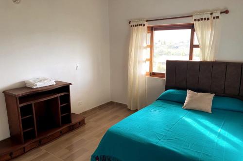 Ένα ή περισσότερα κρεβάτια σε δωμάτιο στο Cabaña Villa de Leyva - Villa Sofia Ritoque #2