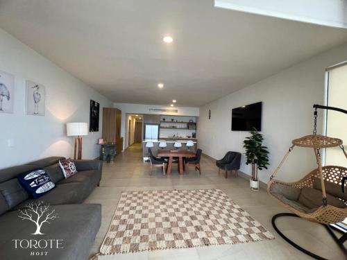 TV a/nebo společenská místnost v ubytování Condominio Frente al Mar