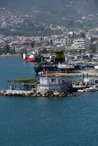 a group of boats docked at a dock in the water at Blue Sea Hotel in Mytilini