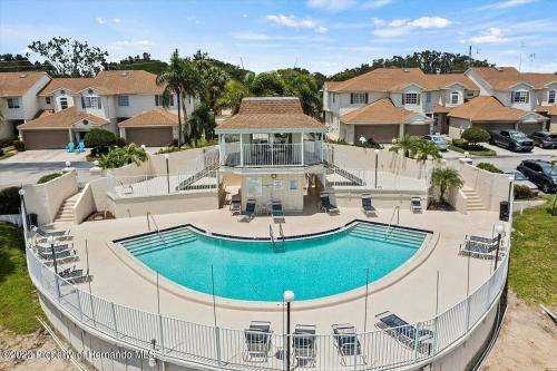 an overhead view of a swimming pool in a house at Sunset Palm Stay - Cozy Retreat Near Gulf Beaches in St. Petersburg