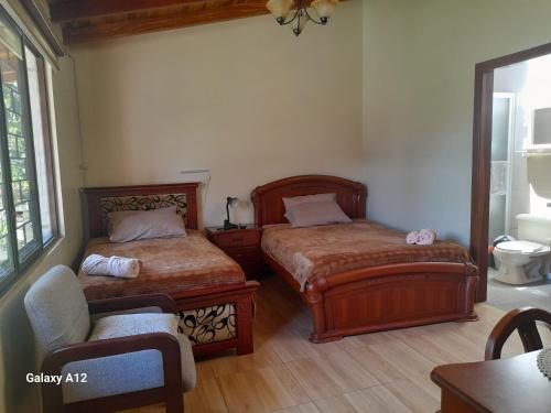 Postel nebo postele na pokoji v ubytování Rose Garden