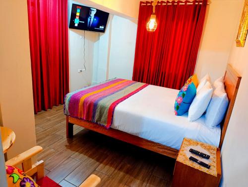 Ένα ή περισσότερα κρεβάτια σε δωμάτιο στο HOSTAl CUSCO-ECOTERRA