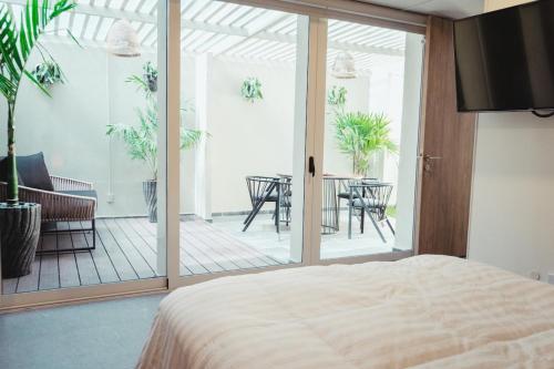 Ένα ή περισσότερα κρεβάτια σε δωμάτιο στο Centro Zapopan