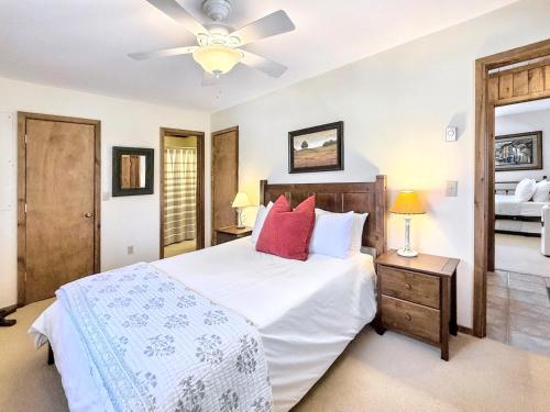 a bedroom with a bed and a ceiling fan at Karma Cabin in Scaly Mountain