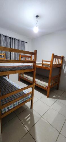 Postel nebo postele na pokoji v ubytování Aconchego da Kelen