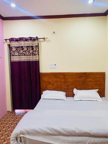 Ένα ή περισσότερα κρεβάτια σε δωμάτιο στο Hills Weather Homestay