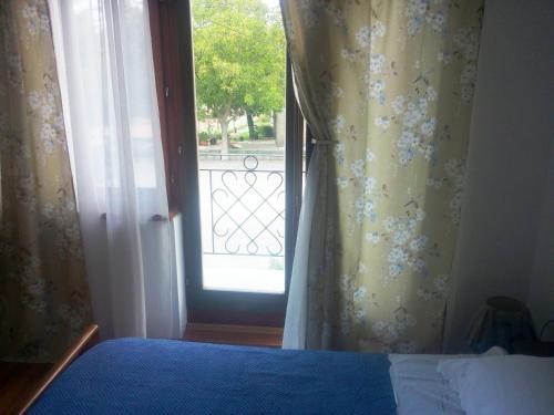 Ένα ή περισσότερα κρεβάτια σε δωμάτιο στο Guest house Sara