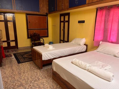 Postel nebo postele na pokoji v ubytování Ram Sethu Home Stay