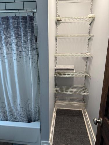 a towel rack in a bathroom with a shower at Buffalo 4BR Home 5 Beds, Near Airport & Downtown in Buffalo