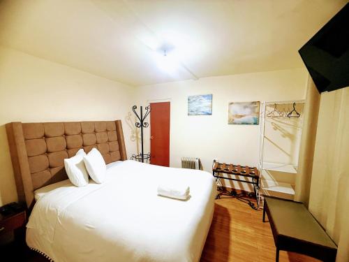 Postel nebo postele na pokoji v ubytování Centro Cusco Inti