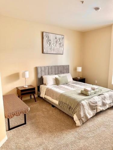 a bedroom with a large bed and two night stands at Spacious 2B 2B Pool View Loft Apartment in Marina Del Rey in Los Angeles