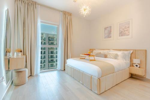 a bedroom with a large bed and a large window at Modern 1-Bed Apartment with Balcony & Free Parking l Near Yas Mall & F1 Yas Island & Sea world in Abu Dhabi