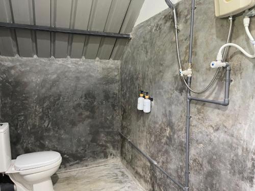 a bathroom with a shower and a toilet at Royal Mountain Edge ,Knuckles in Rangala