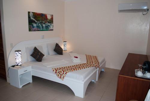 Voodi või voodid majutusasutuse Quo Vadis Dive Resort toas