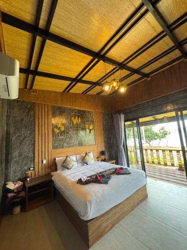 Postel nebo postele na pokoji v ubytování Baan Rattana