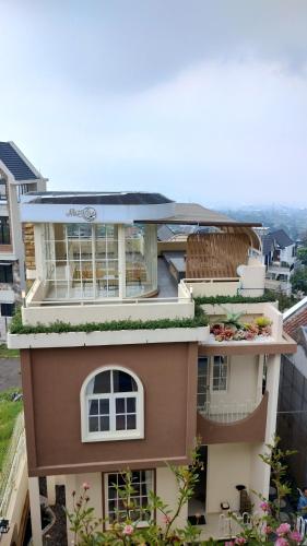 a view of a house with a balcony at Maison Belle Villa in Tlekung