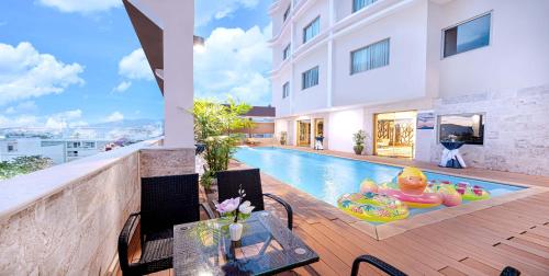 a swimming pool in the middle of a house at Sandals Stay Hotel in Da Nang