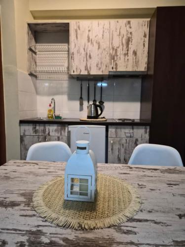 a bottle of water sitting on top of a table at Centar Novi Sad Studio No2 PARKING ON REQUEST in Novi Sad